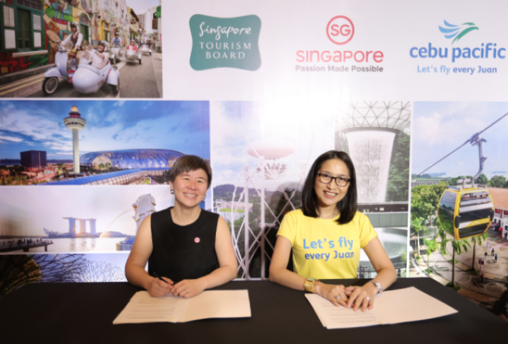 Juliana Kua and Candice Iyog formally sign the MOU between the Singapore Tourism Board and Cebu Pacific