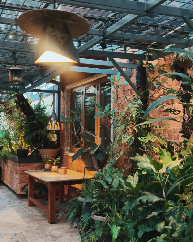 a patio with plants and a table Hakon Ethnic Things to Do in Jakarta